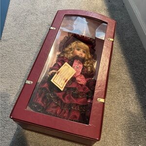 Elegant Red and Black Porcelain Doll